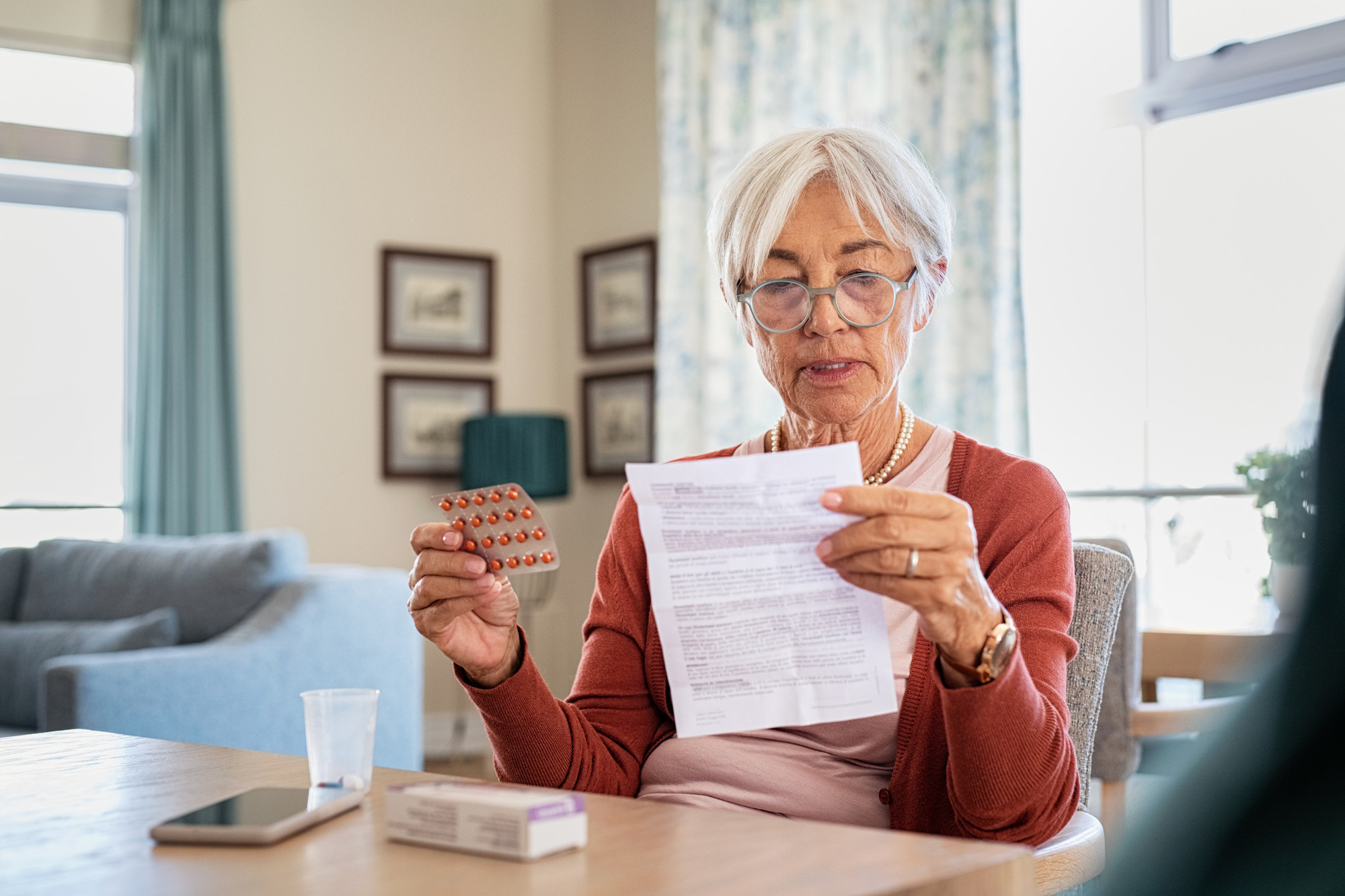 patient reading the instructions for her medications