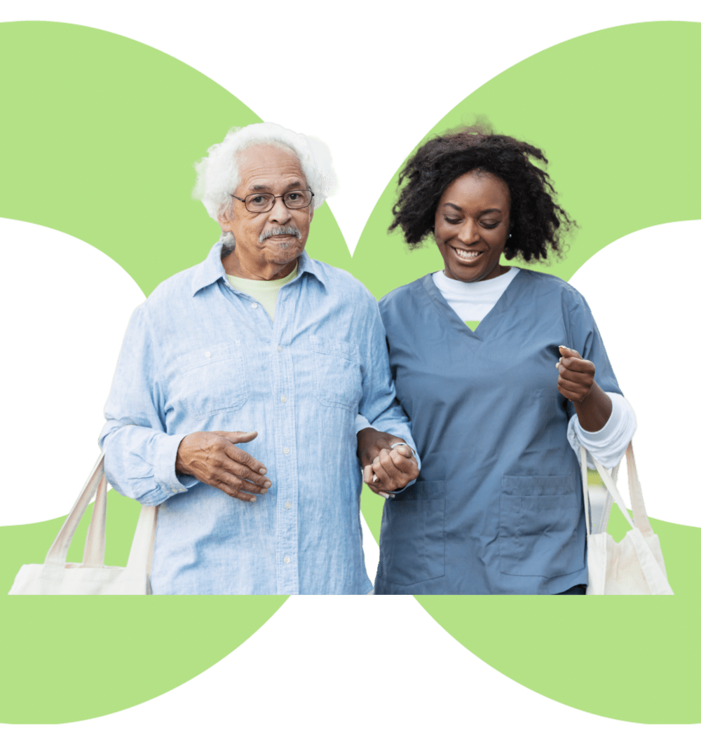 women nurse helping an elderly man walk