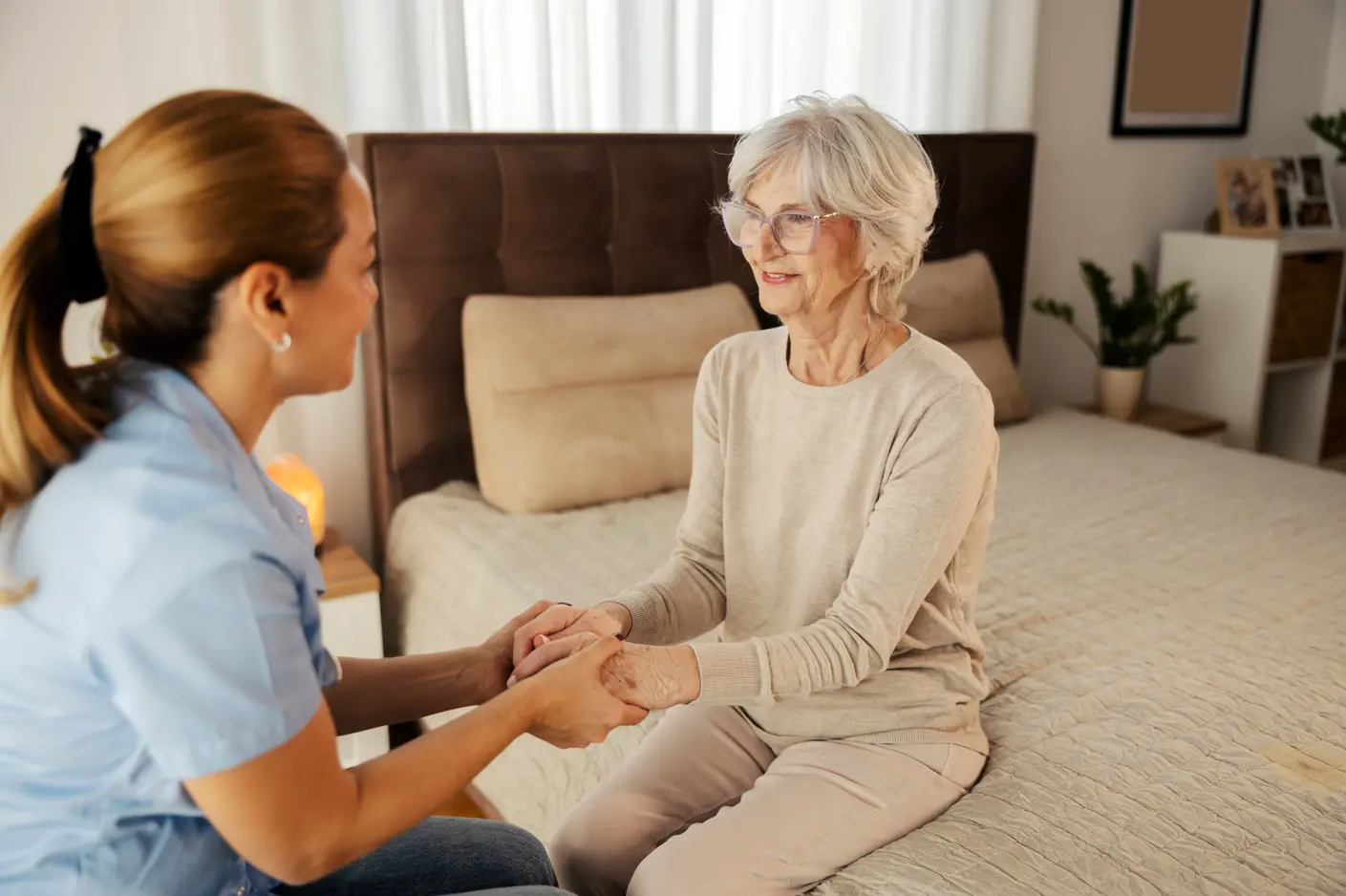 A health care provider providing an in-home assessment to a patient.