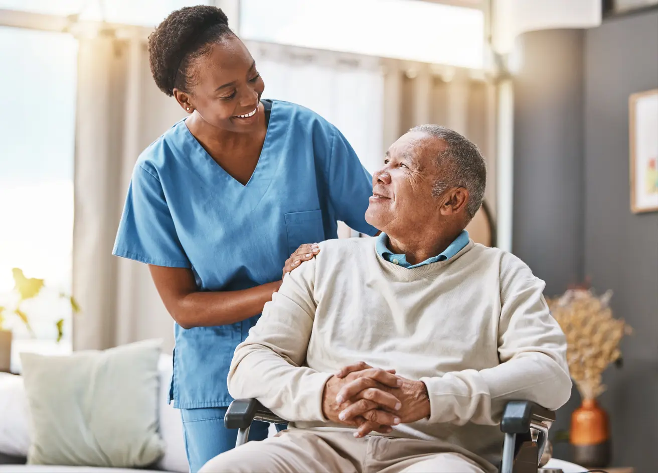 A health care provider closing care gaps with her patient in a wheelchair