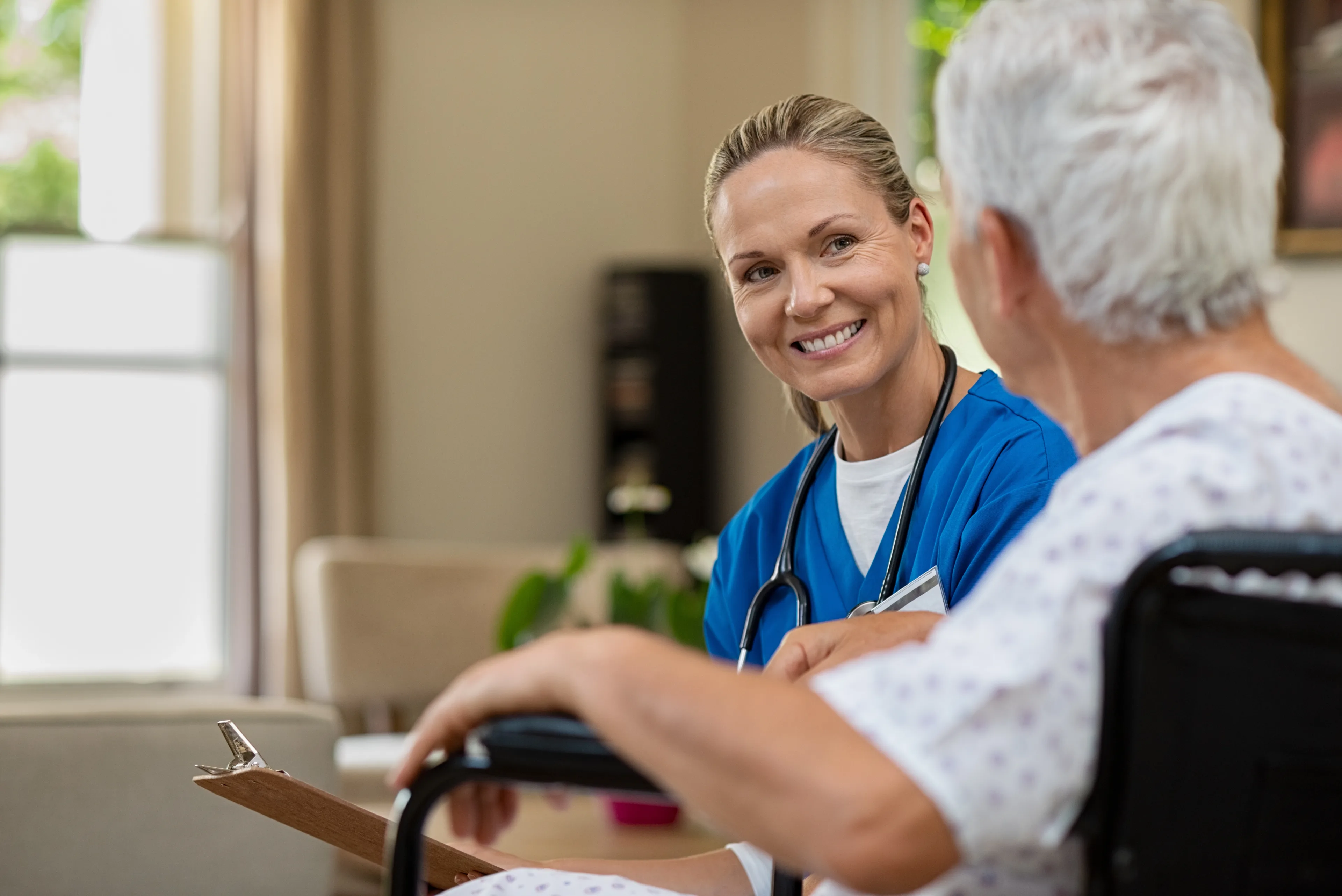 a clinician providing whole-person care during a in-home health visit